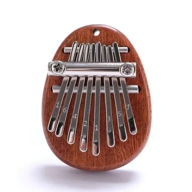 HarmoPalm™ - Play Soothing Tunes Effortlessly with This Mini Thumb Piano