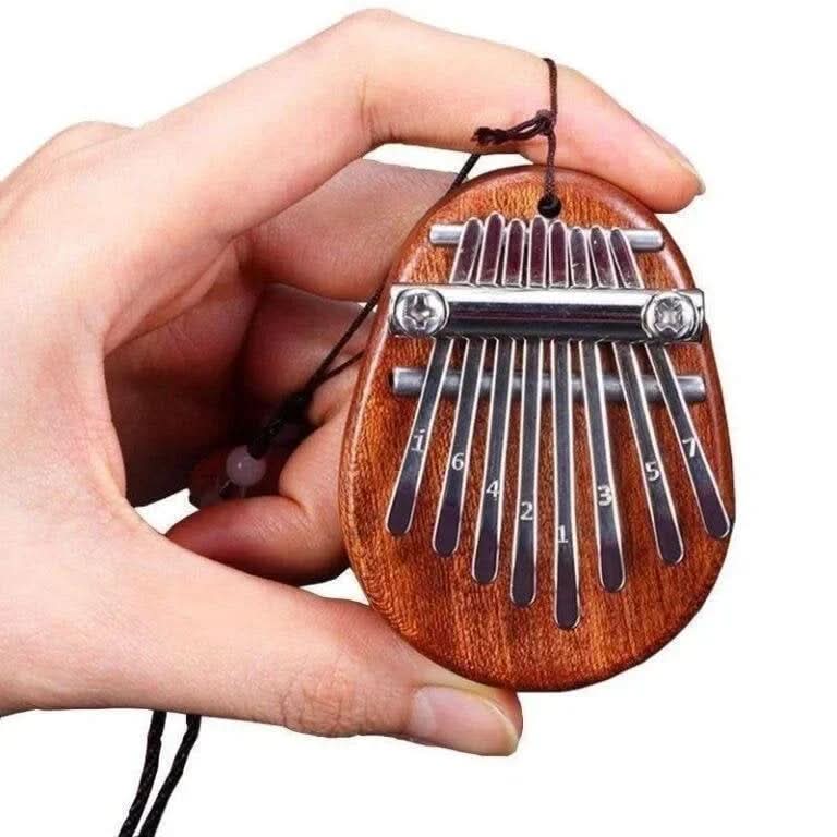 HarmoPalm™ - Play Soothing Tunes Effortlessly with This Mini Thumb Piano