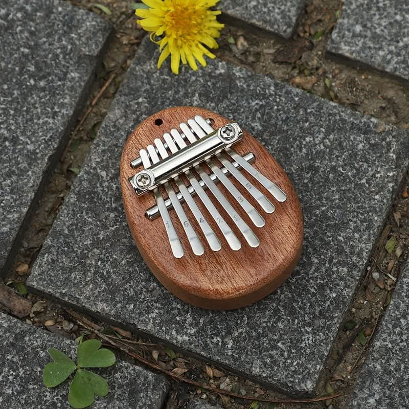 HarmoPalm™ - Play Soothing Tunes Effortlessly with This Mini Thumb Piano