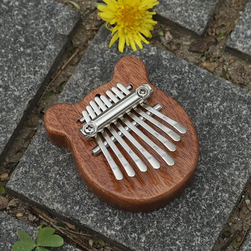 HarmoPalm™ - Play Soothing Tunes Effortlessly with This Mini Thumb Piano