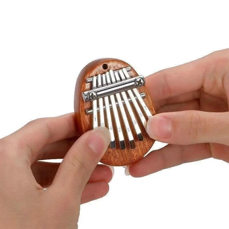 HarmoPalm™ - Play Soothing Tunes Effortlessly with This Mini Thumb Piano