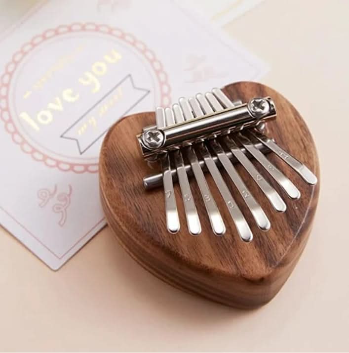 HarmoPalm™ - Play Soothing Tunes Effortlessly with This Mini Thumb Piano